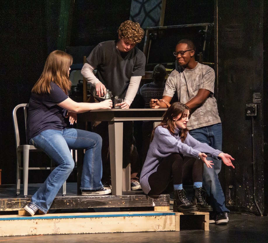 NE students Cas Wheatley, Brooks Gentry, Ethan
Cox and Caliana Graham run through a scene of
“The Laramie Project.” The play showcases the
town’s reaction to Matthew Shepard’s murder. Shepard was murdered due to his sexuality, which led to historic changes in hate crime legislation.